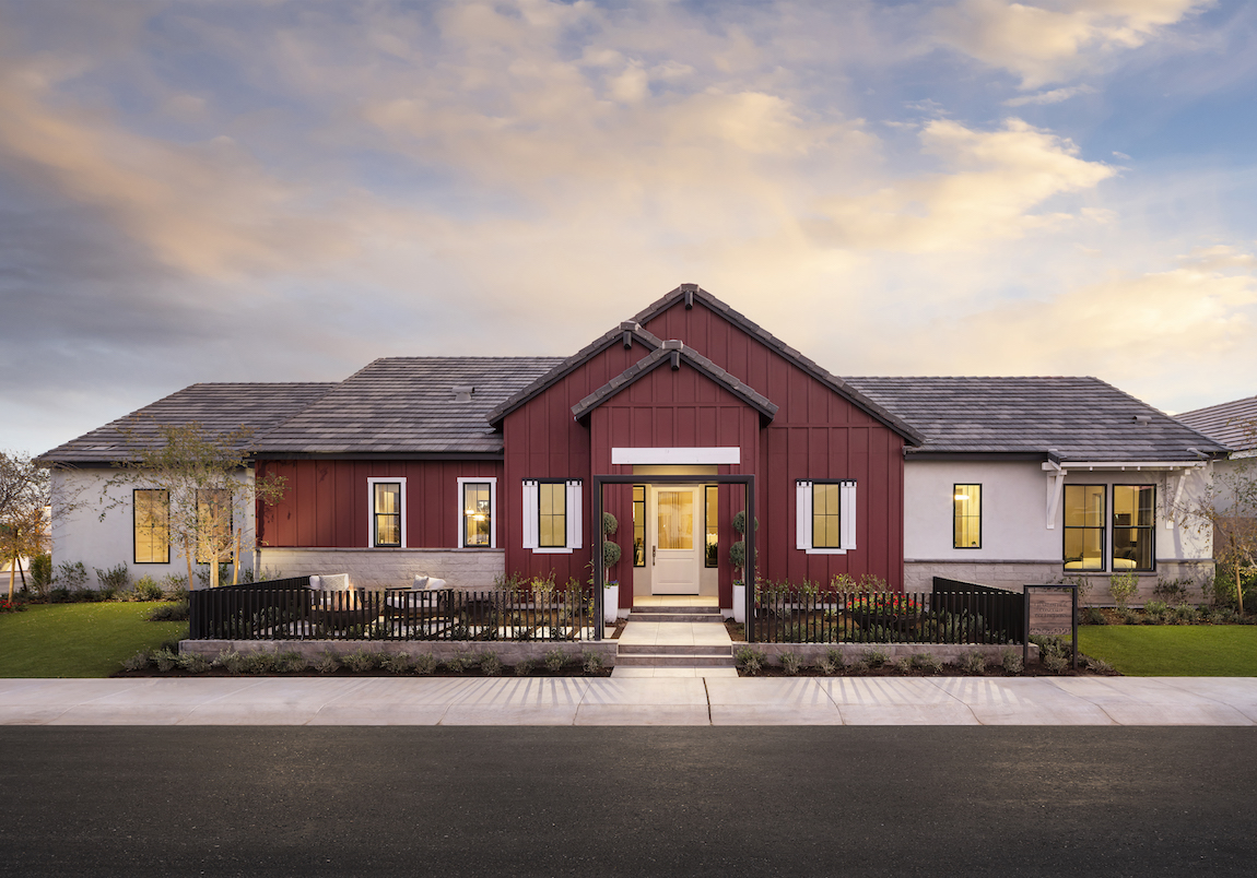 Modern farmhouse with a dark red home exterior color. 