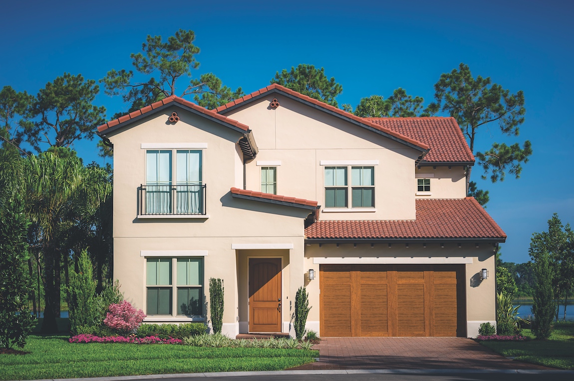 A Toll Brothers mediterranean home design with terracotta roof tiles.