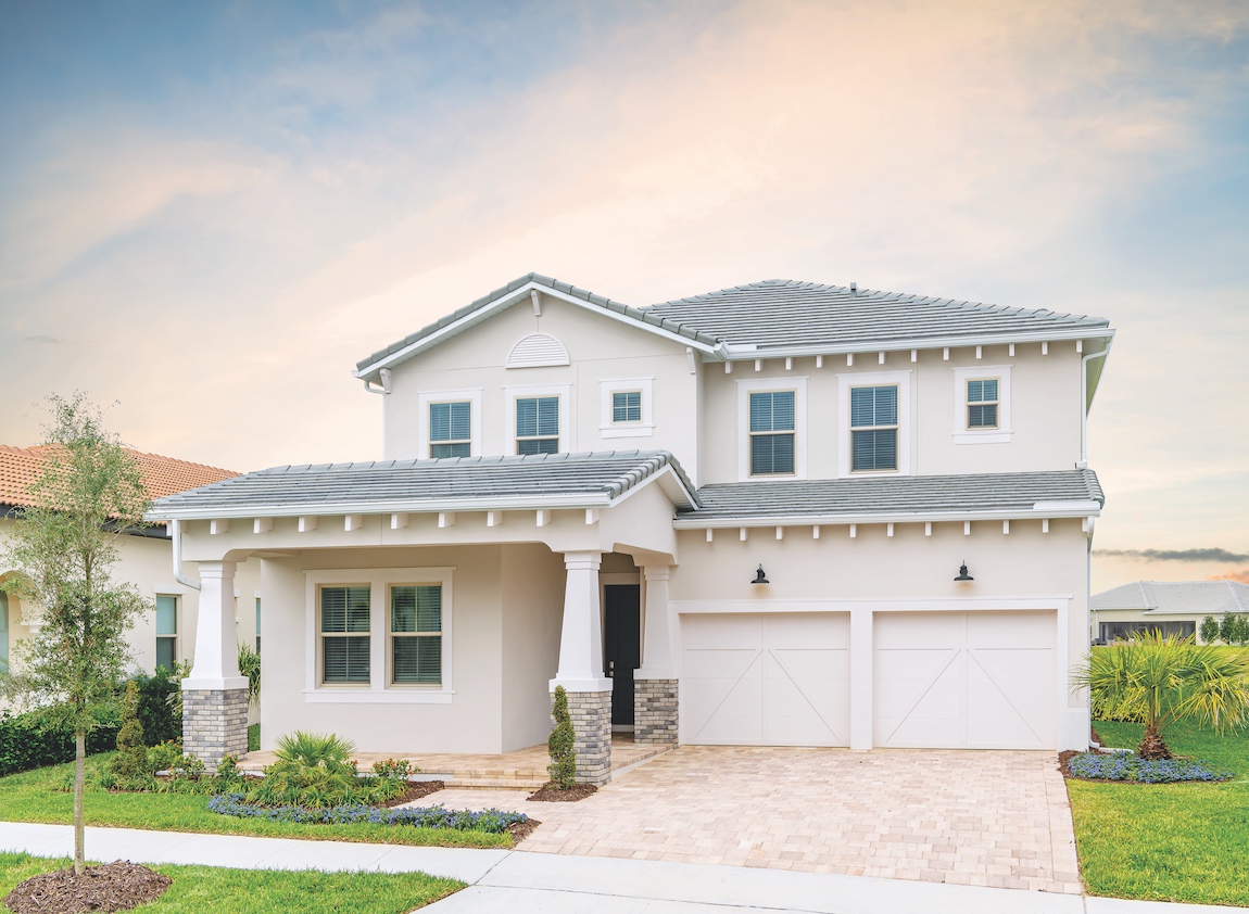 Florida craftsman house with exposed rafters and tapered columns.