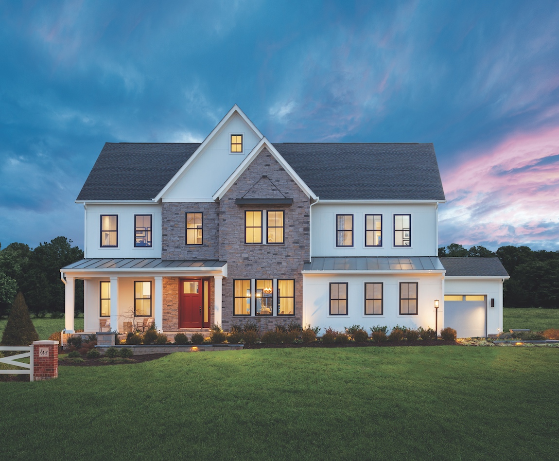 Exterior of a new construction home in Virginia with subtle outdoor lighting.