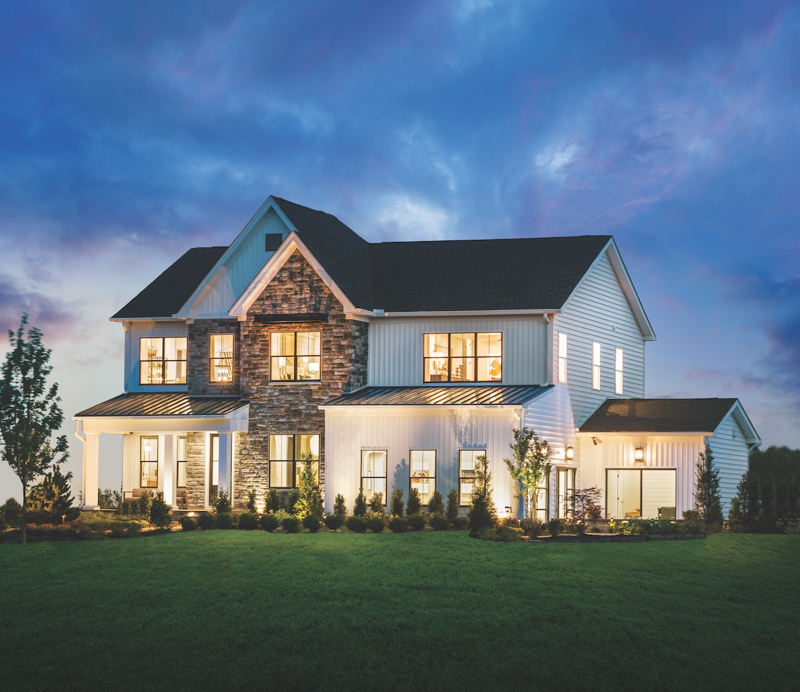 Luxury home in Pennsylvania with accent lighting along the exterior.