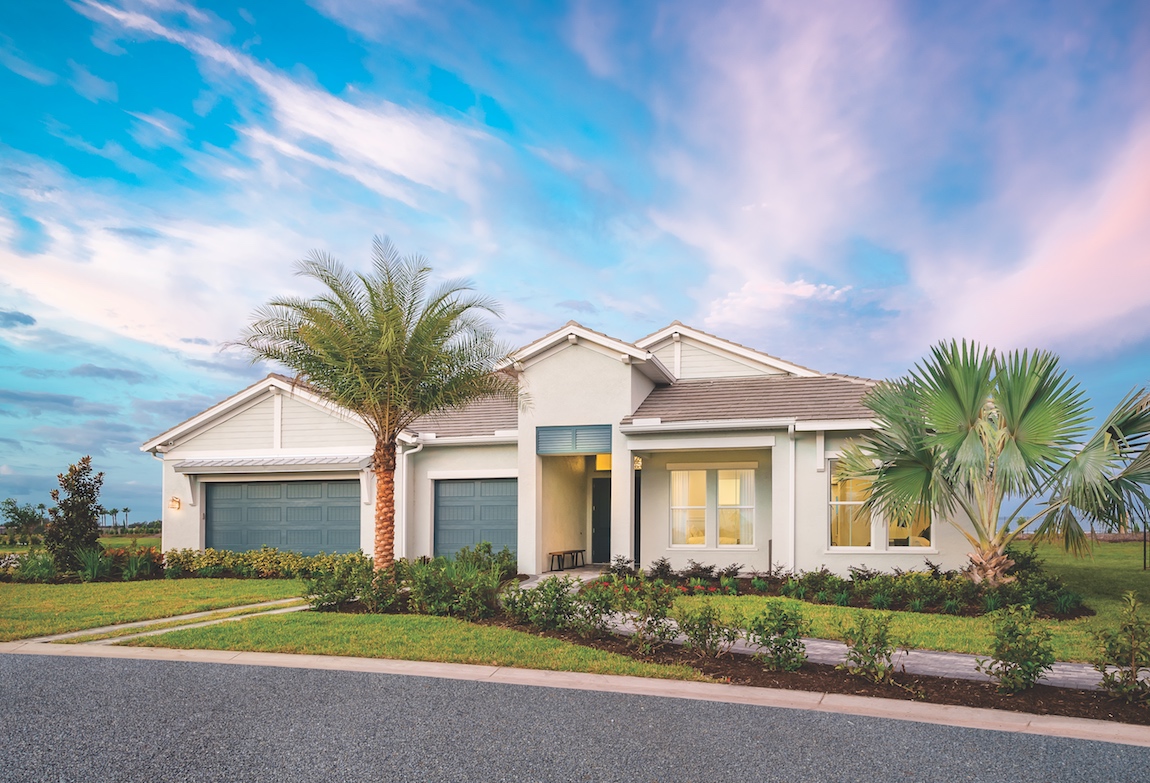 Exterior of a Toll Brothers home with gray aqua doors.