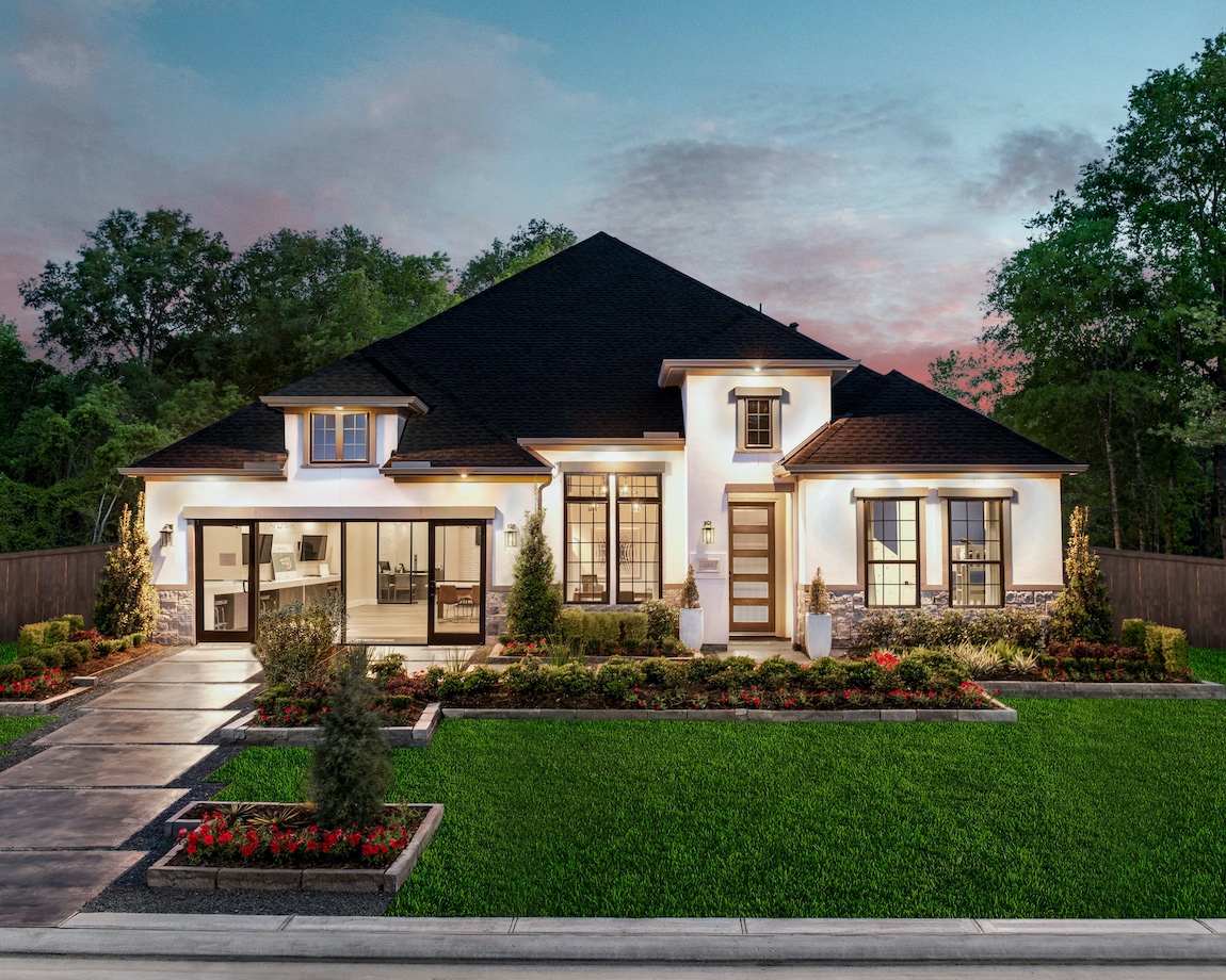 Exterior of a luxury home in Texas with a fully lit up exterior.