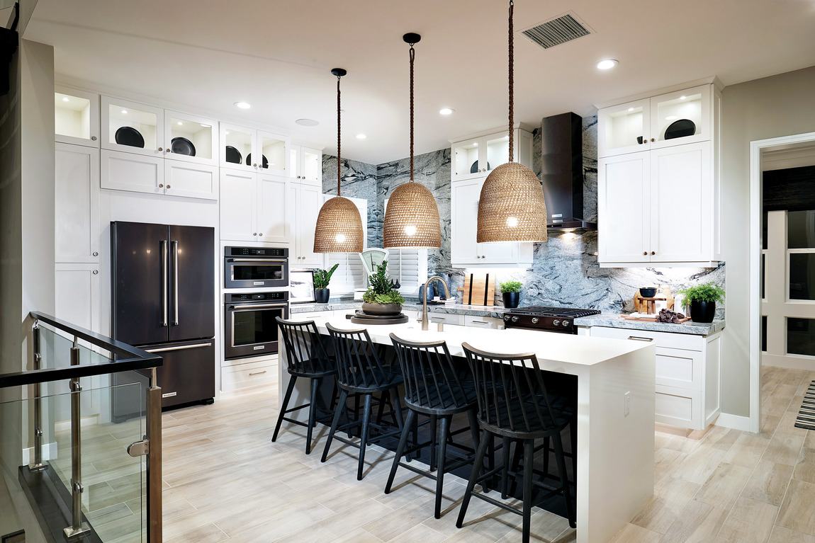 A modern farmhouse kitchen design with a black and white color scheme.