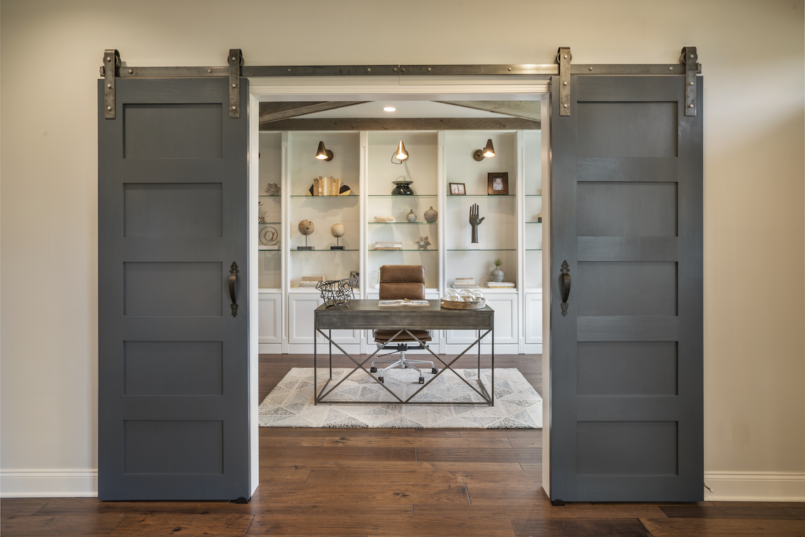 Craftsman style barn door in a home office.