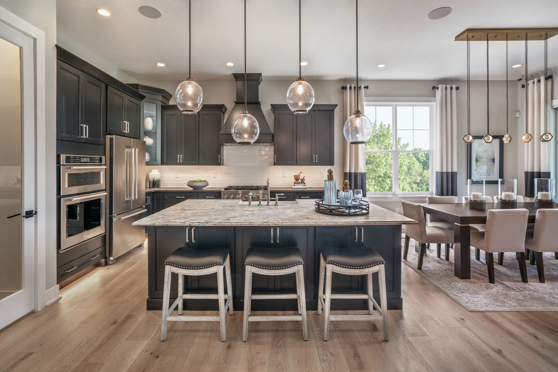 Kitchen design featuring ample storage space and black color scheme