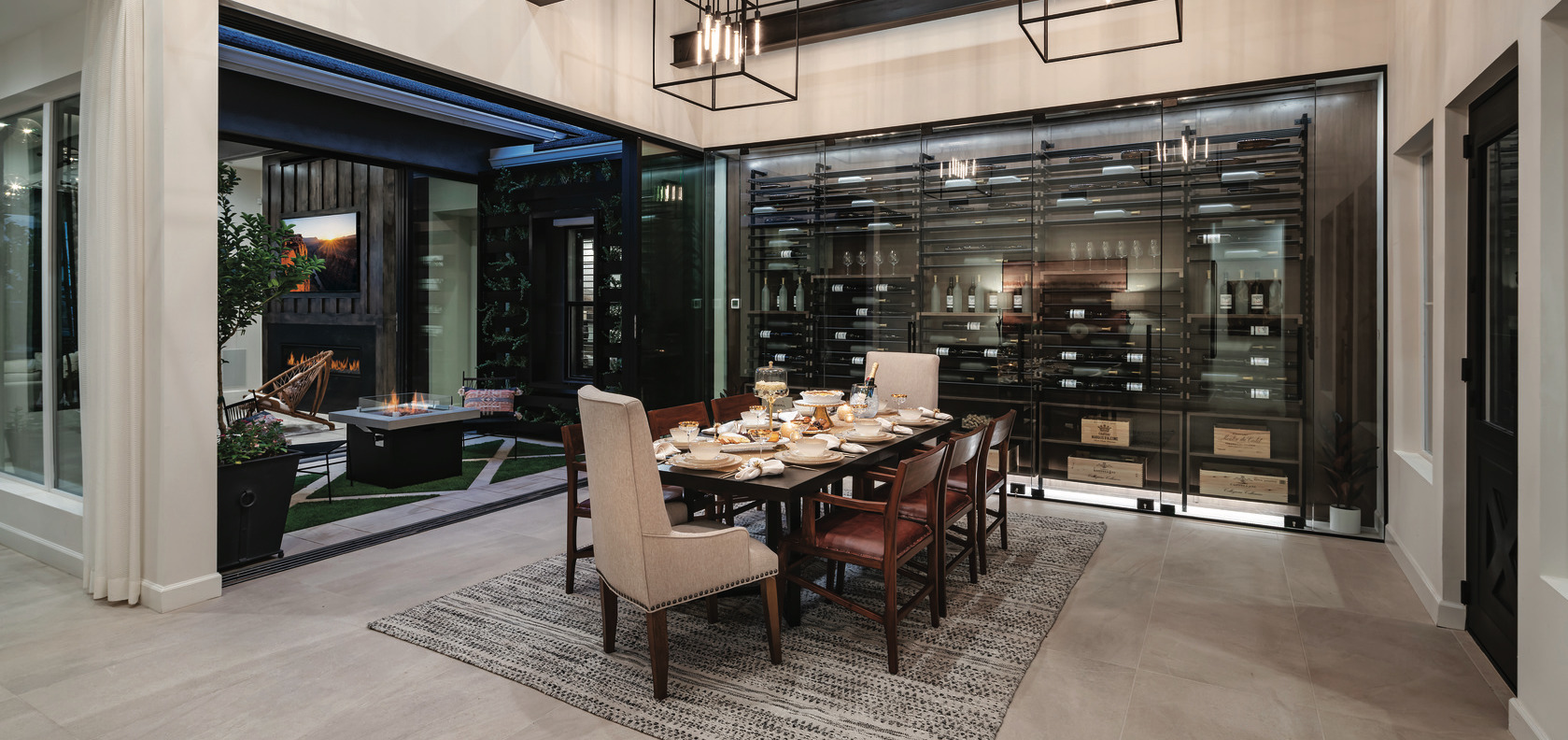 Dining room with wine room and view to outdoor living space