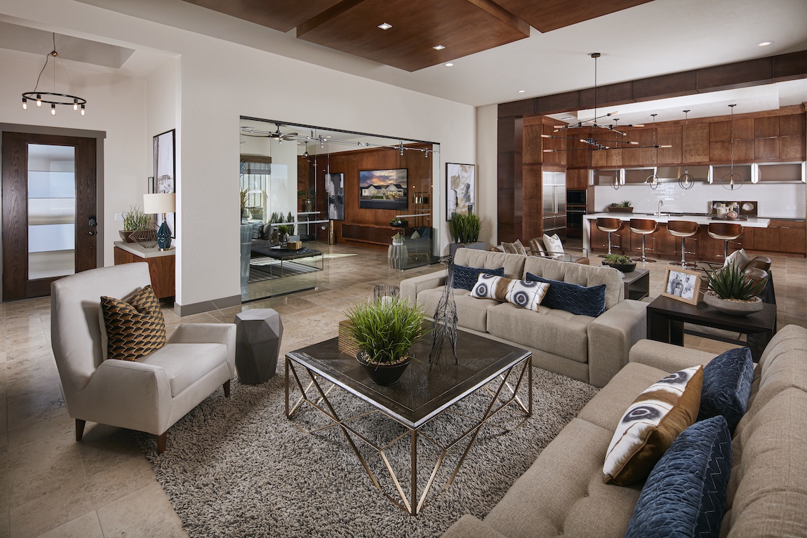 Living space with large glass sliding doors separating a room with a television.