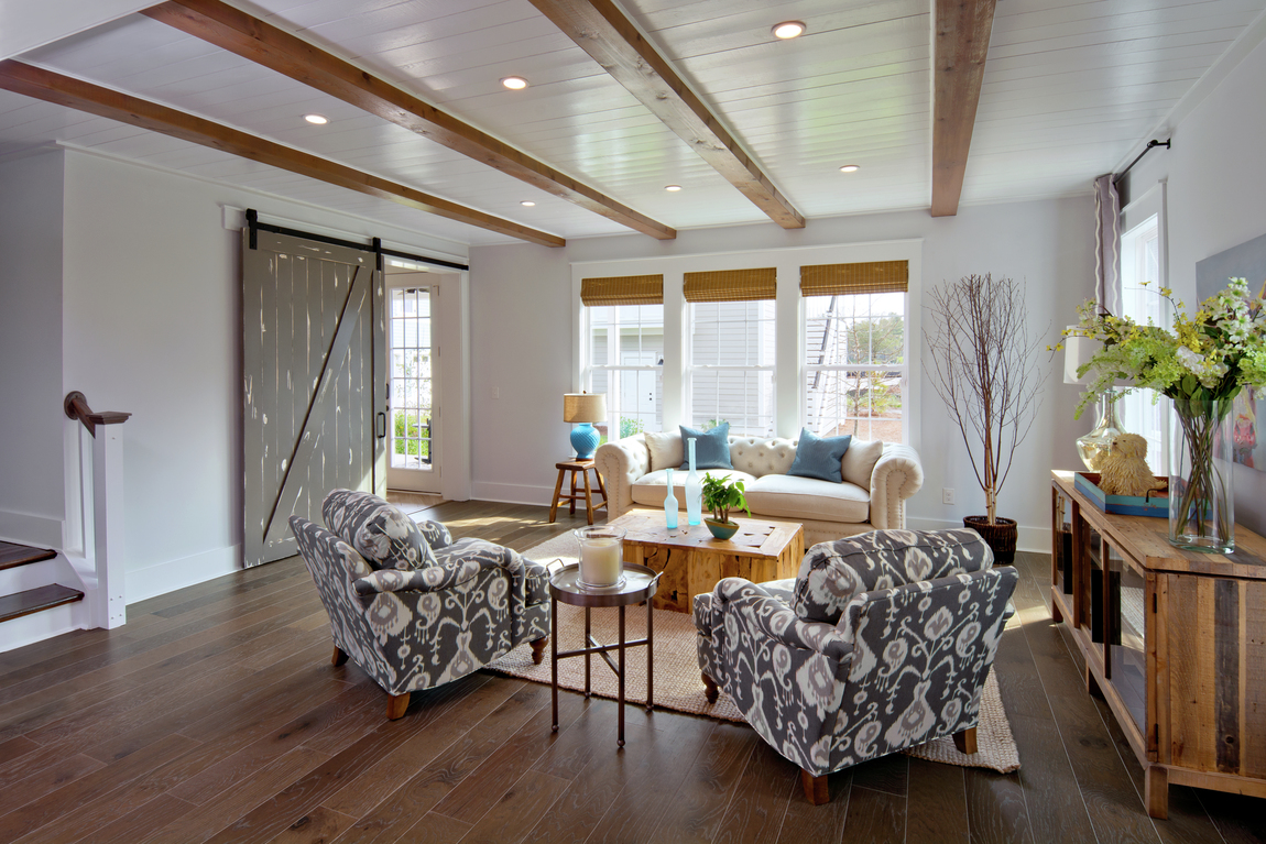 A rustic sliding door in a living room.