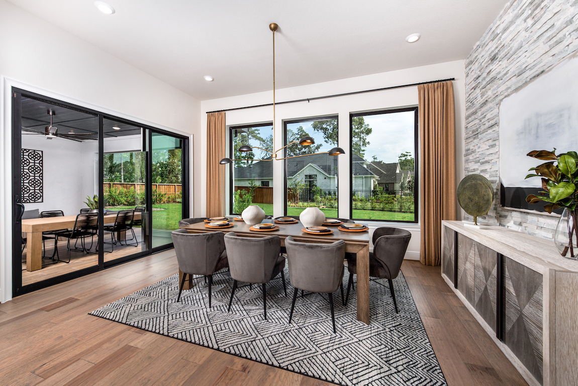 modern dining room adjacent to patio