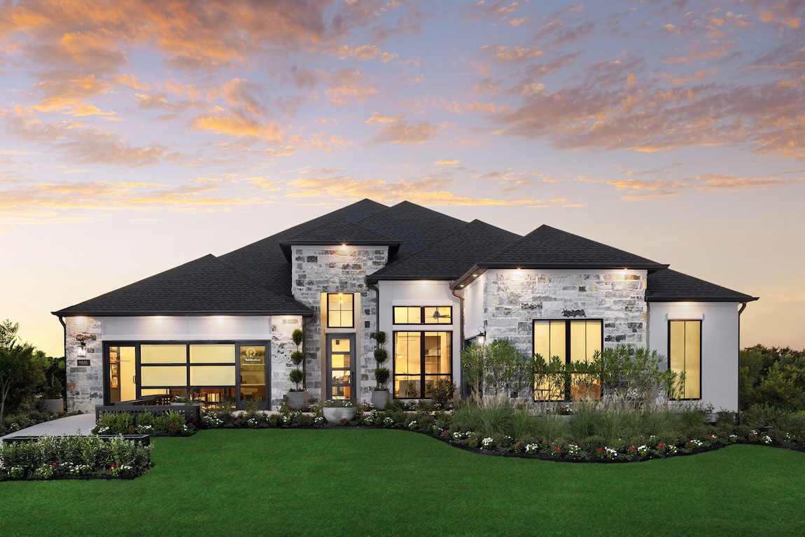 exterior of stone home with modern lighting