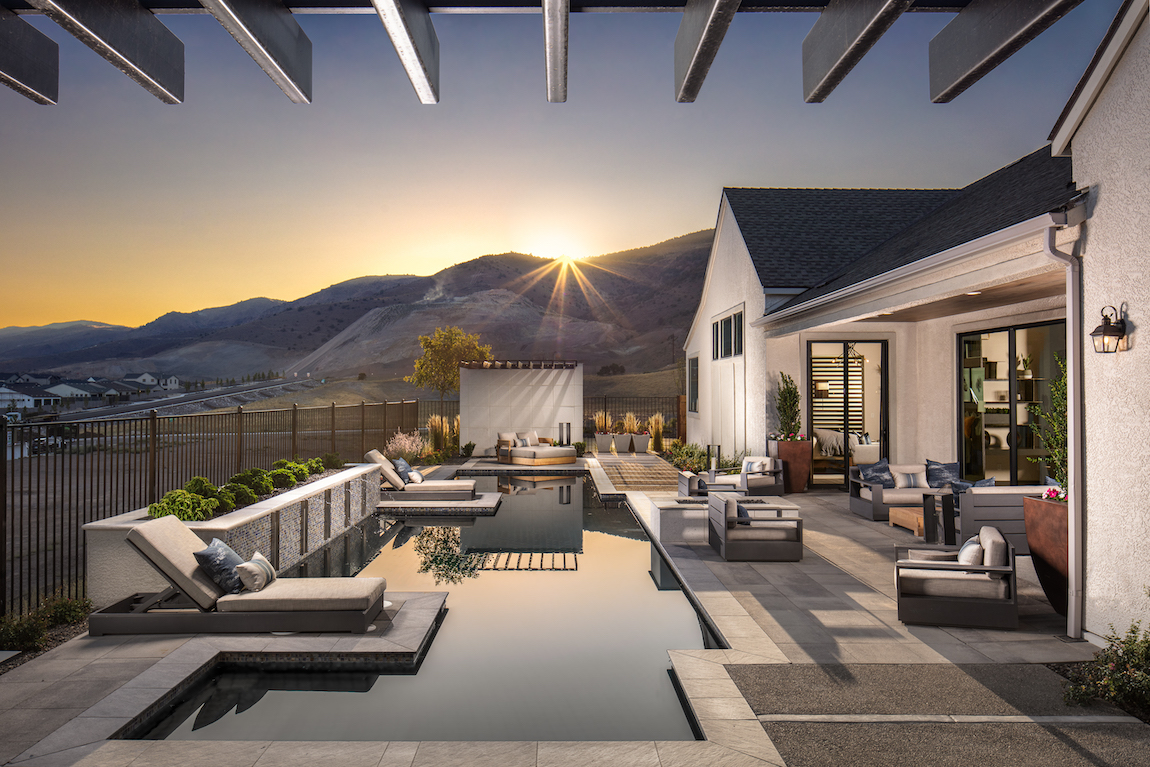 A narrow pool is a backyard in Reno with views of the mountains.