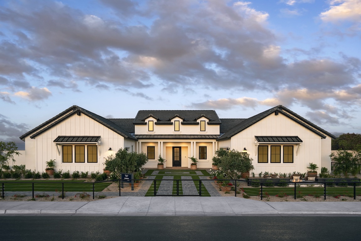 modern farmhouse exterior with lush landscaping