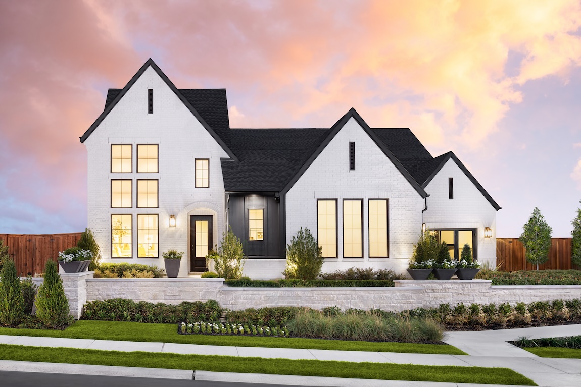 modern exterior of home with lights illuminating the walkway
