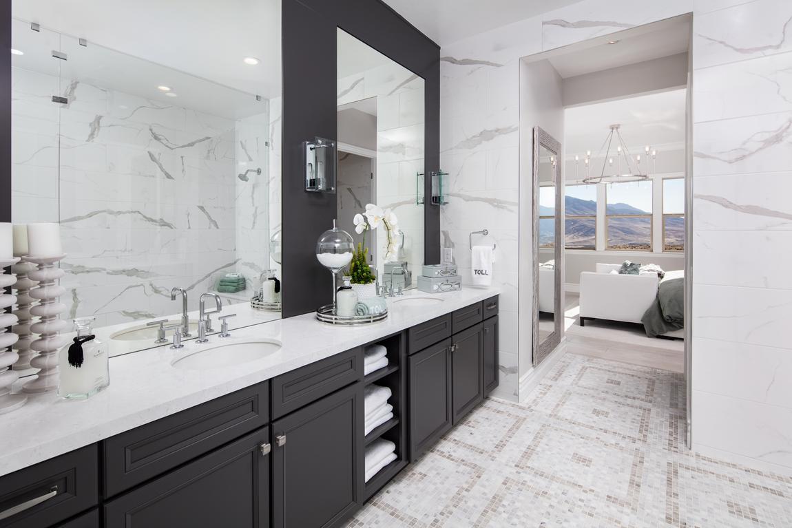 Primary bedroom attached to primary bedroom with black and white marble accents