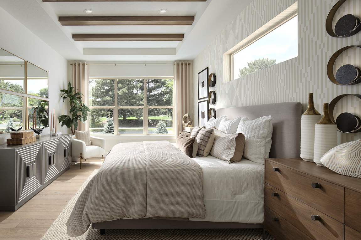Luxury bedroom design with white and creme color scheme and dark wood accented ceiling beams. 