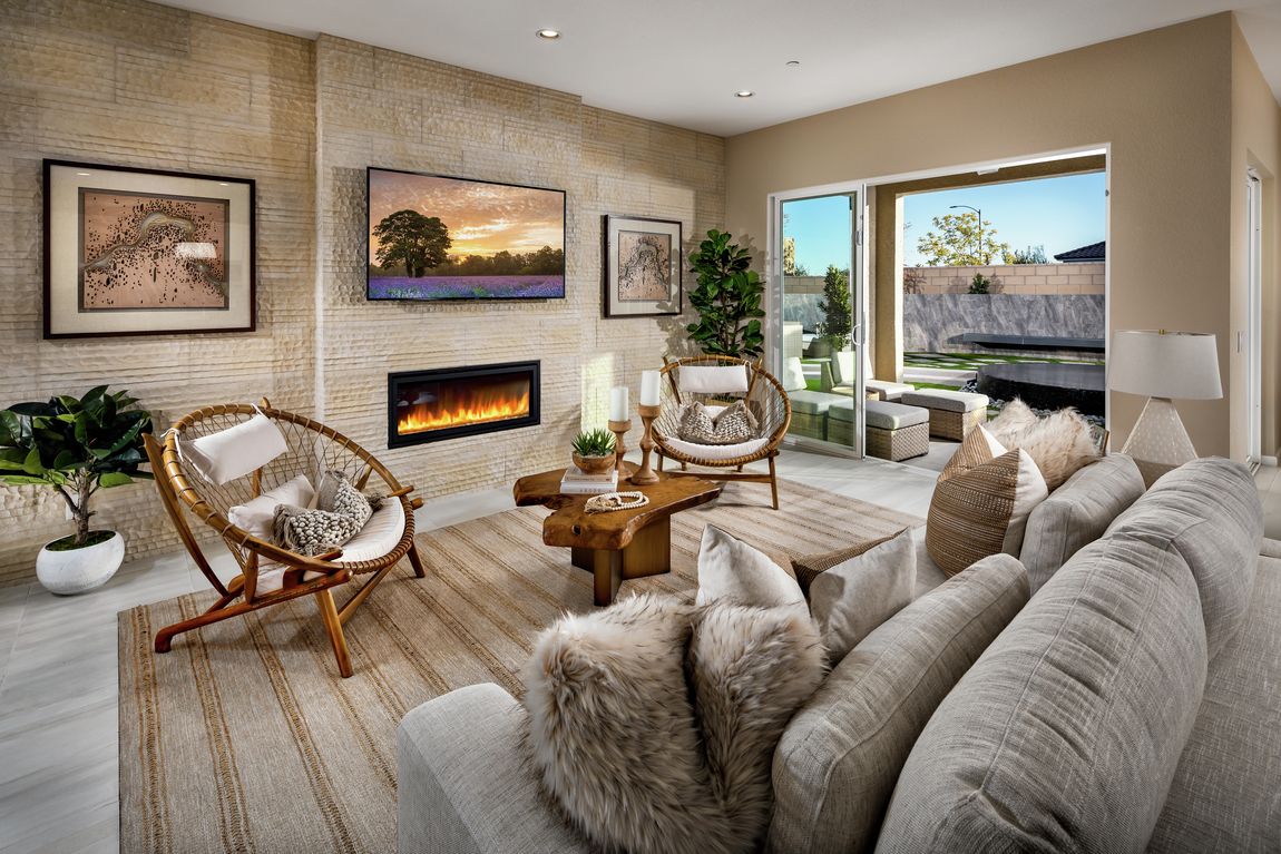 A modern linear fireplace in a luxury living room.