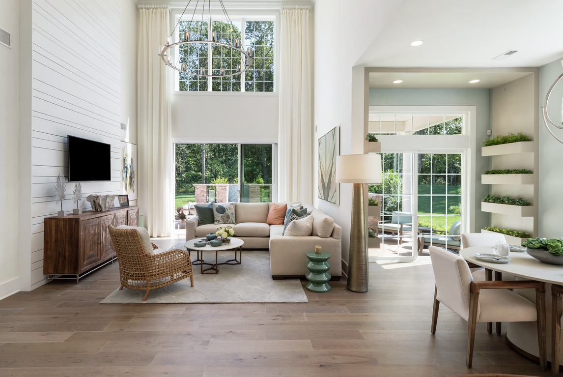 Two-story great room featuring cascading curtains