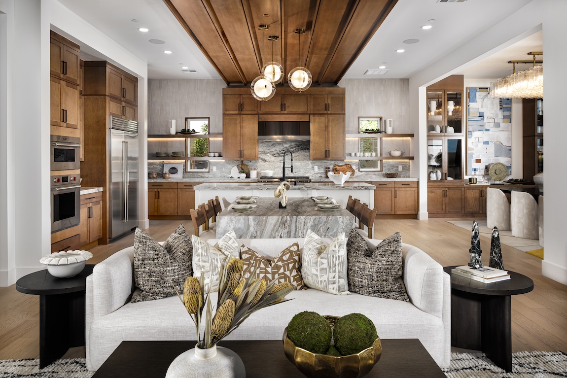 large kitchen with wooden cabinets and perpendicular kitchen island