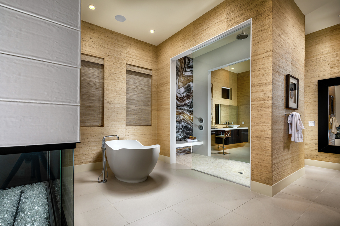 Large bathroom with a rain head shower and a freestanding bathtub.