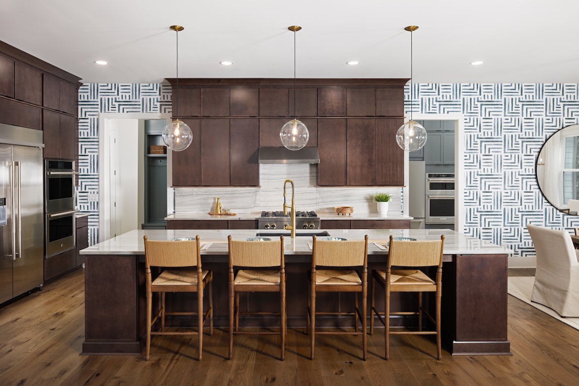 kitchen with wooden cabinets and wallpaper