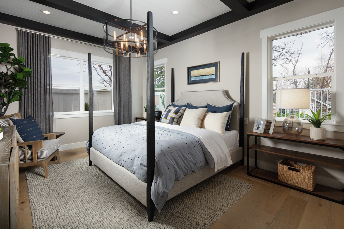 Elegant bedroom highlighted by chandelier