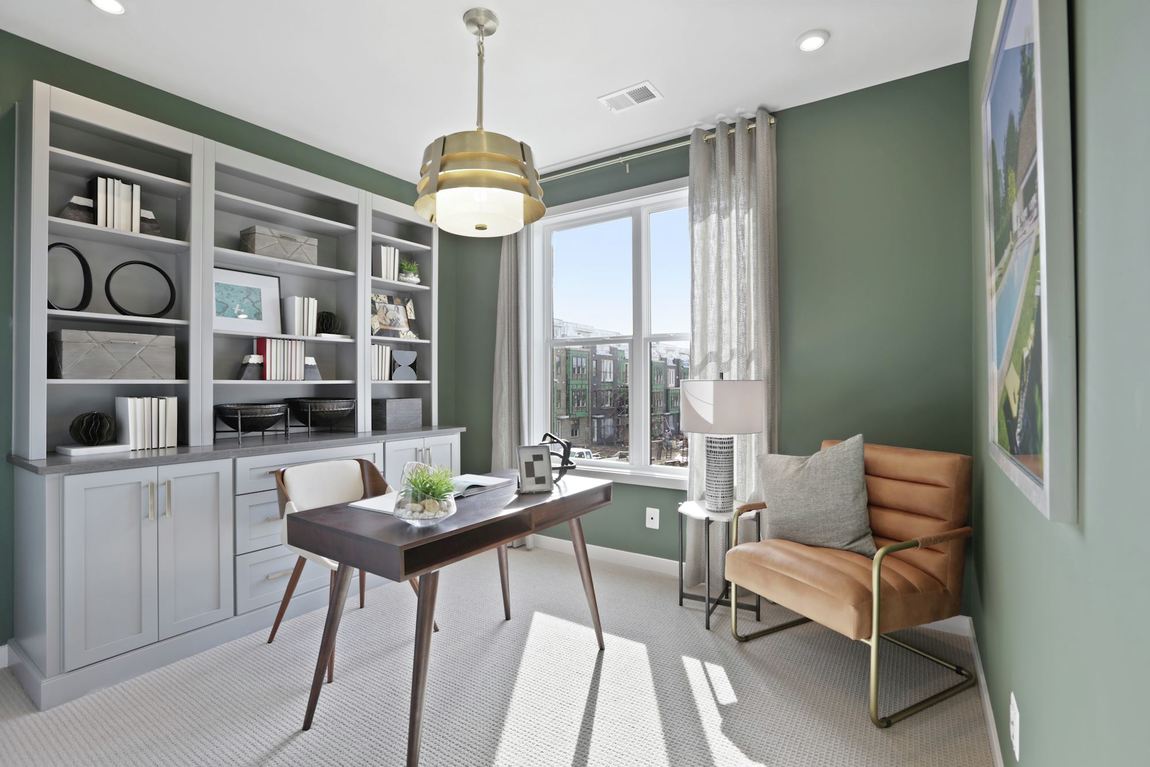 Modern home office featuring subtle green paint color
