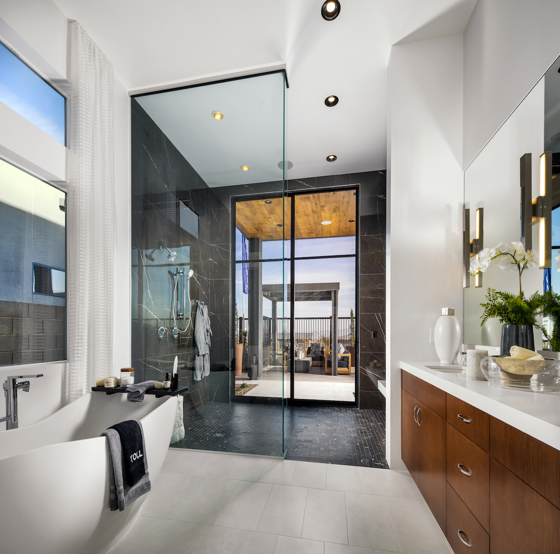 Primary bathroom with a black tile shower.