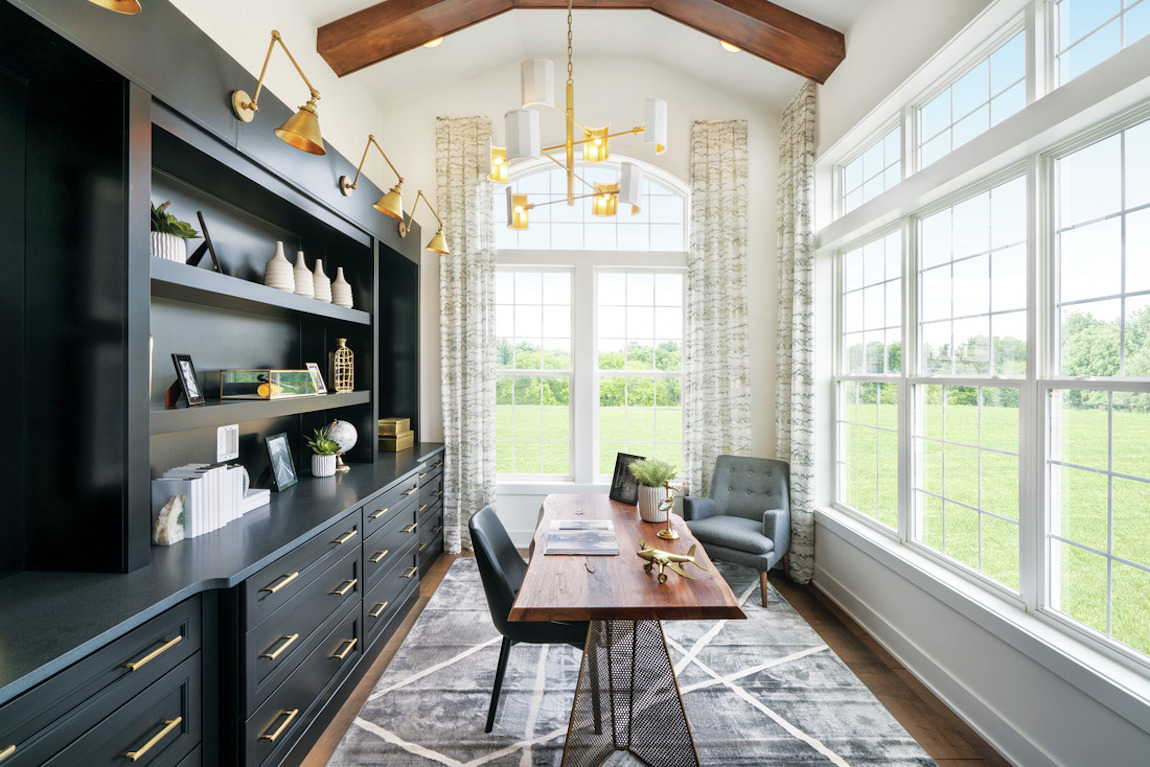 Home office elevated by plethora of natural sunlight and windows