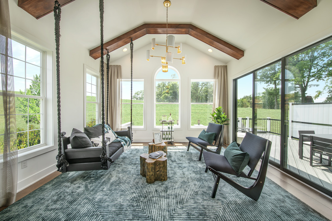 Sunroom with faulted wood beam ceiling