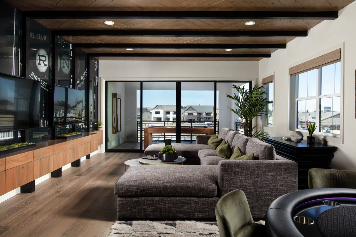 loft with wood beam ceilings