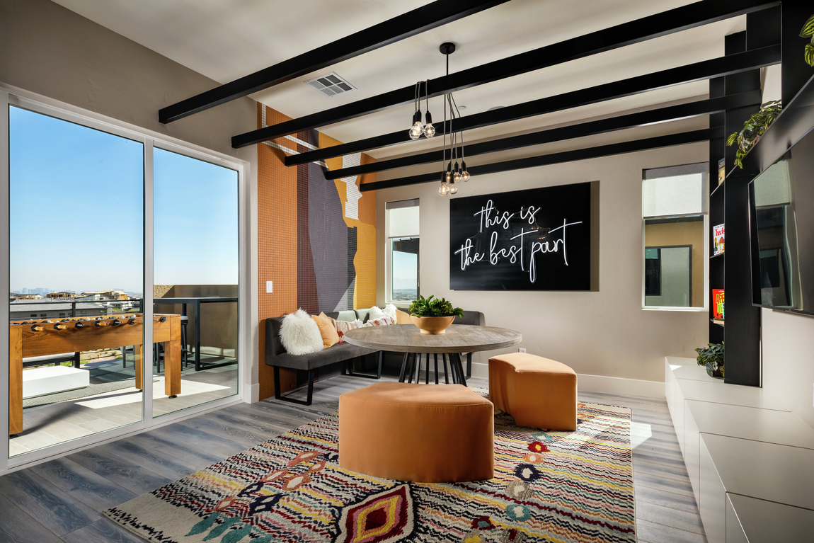 bonus room with black wood beam ceilings