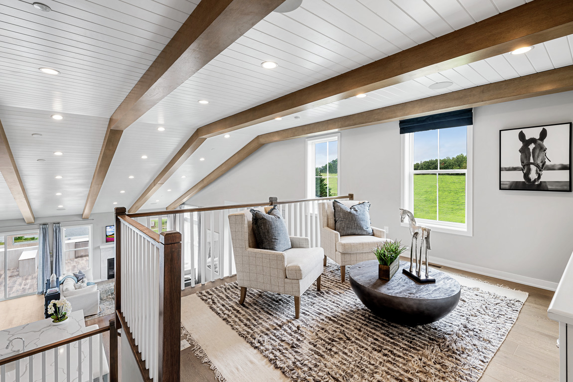 Loft featuring wood beams