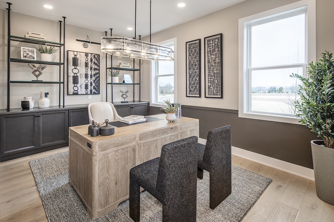 modern home office with built in storage and a large wooden desk
