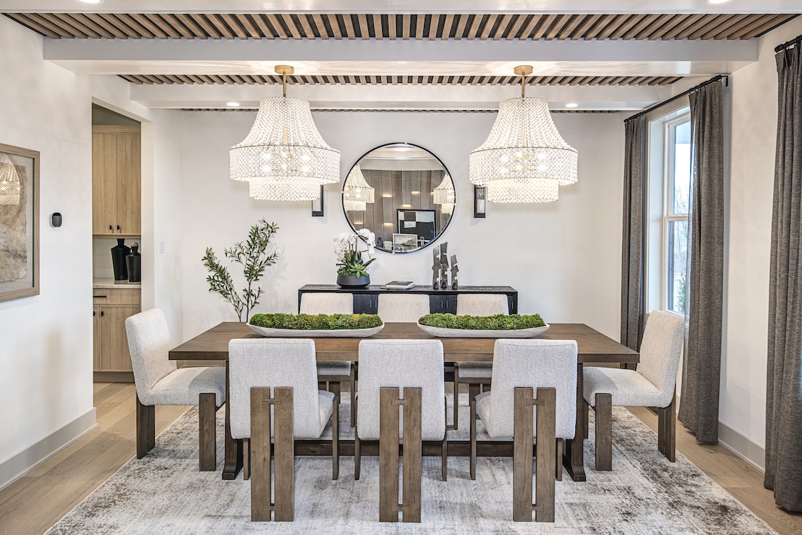 modern farmhouse dining room with statement chandeliers