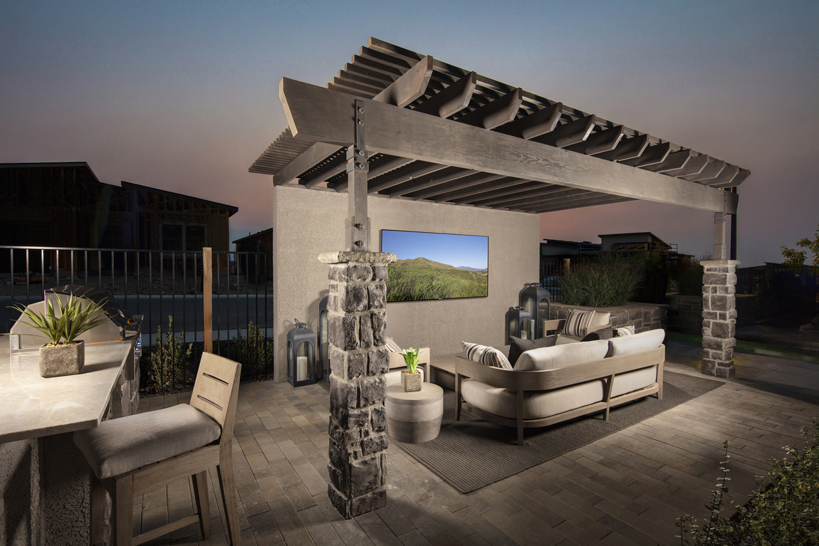 outdoor living space highlighted by tv setup