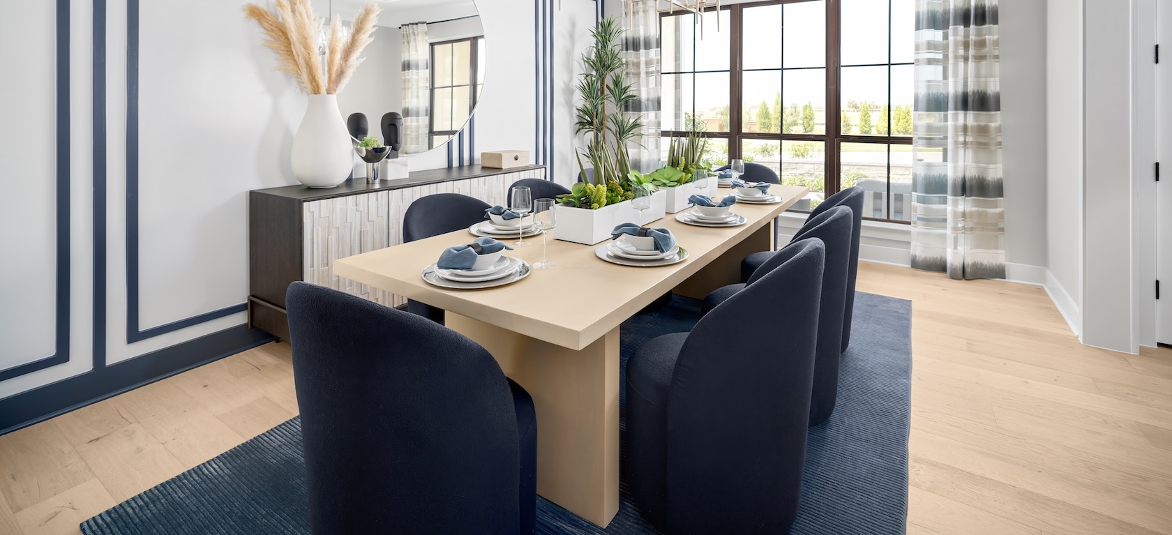 modern dining room with plush blue chairs