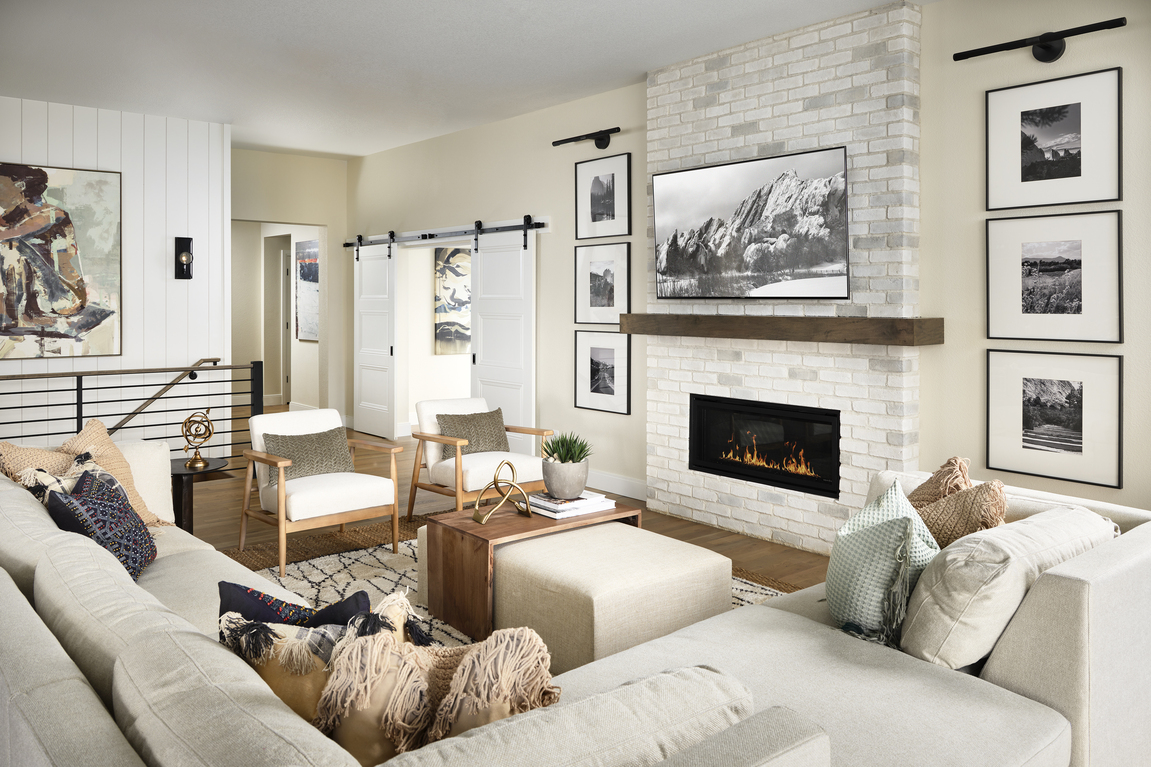 Farmhouse interior with fireplace and barn door