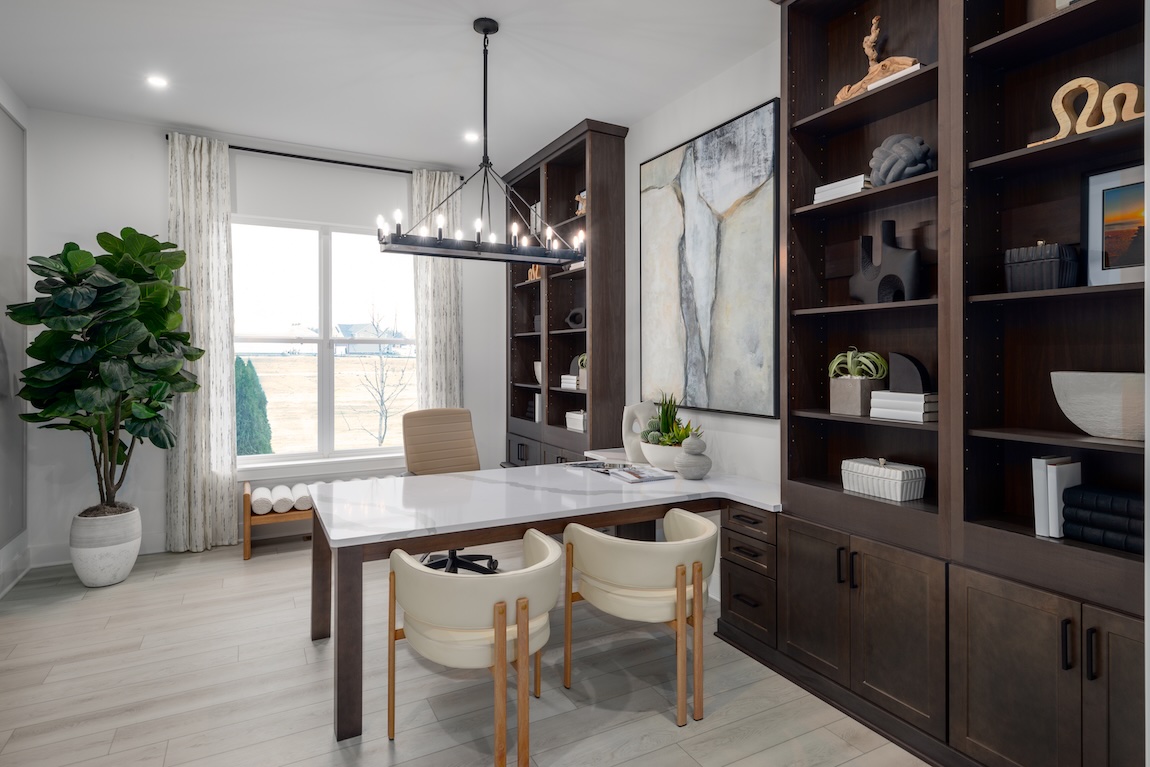 home office with storage shelves and ample seating