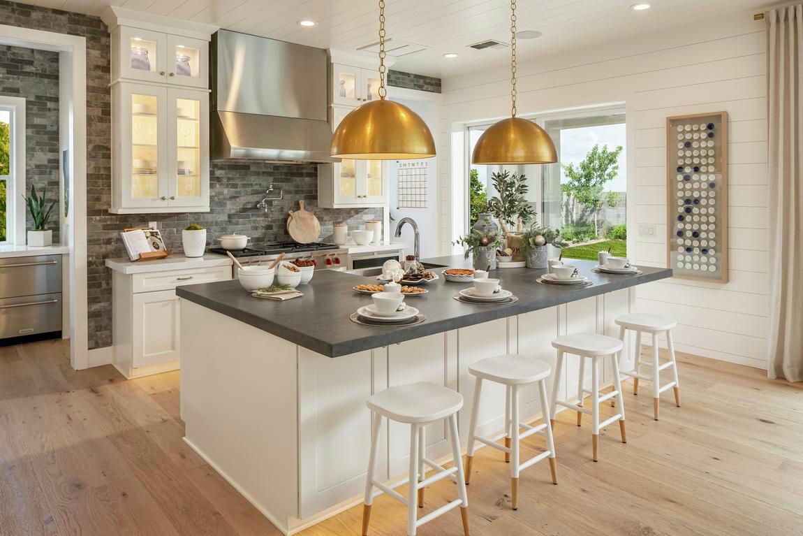 Traditional kitchen utilizing brick and metallic accents