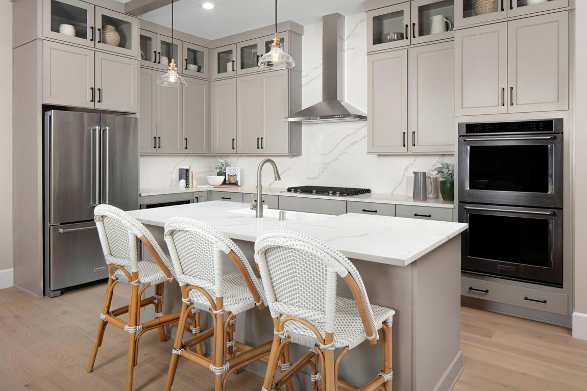 Kitchen featuring marble backsplash