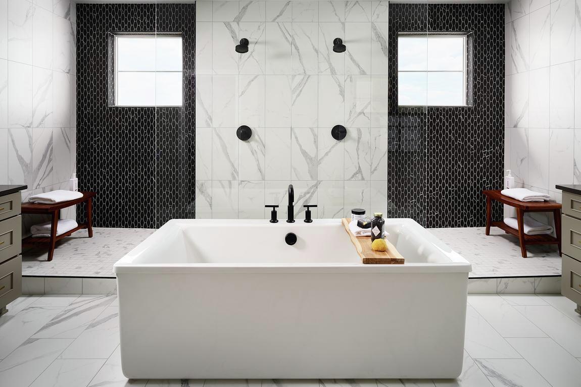 dual shower design with freestanding bathtub in front