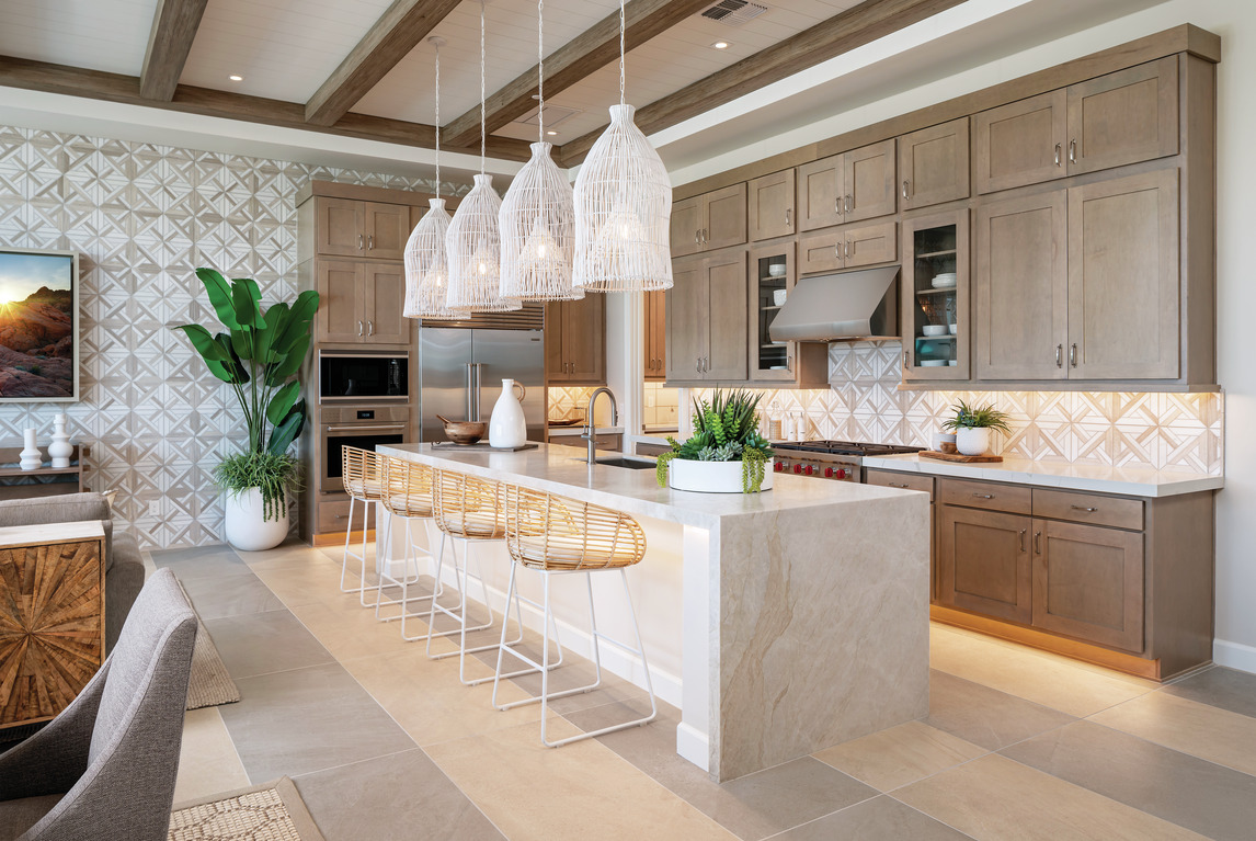 Farmhouse kitchen using two popular tile styles, large format and decorative