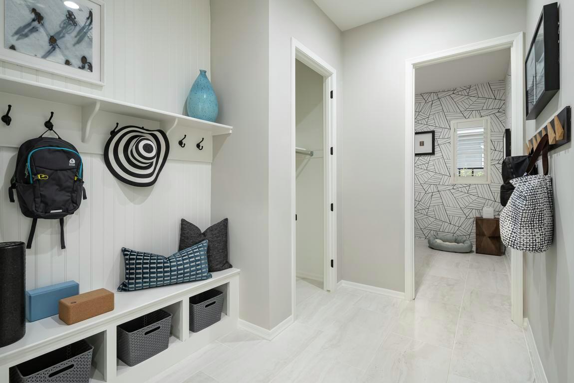 Resourceful mudroom design with ample shelving