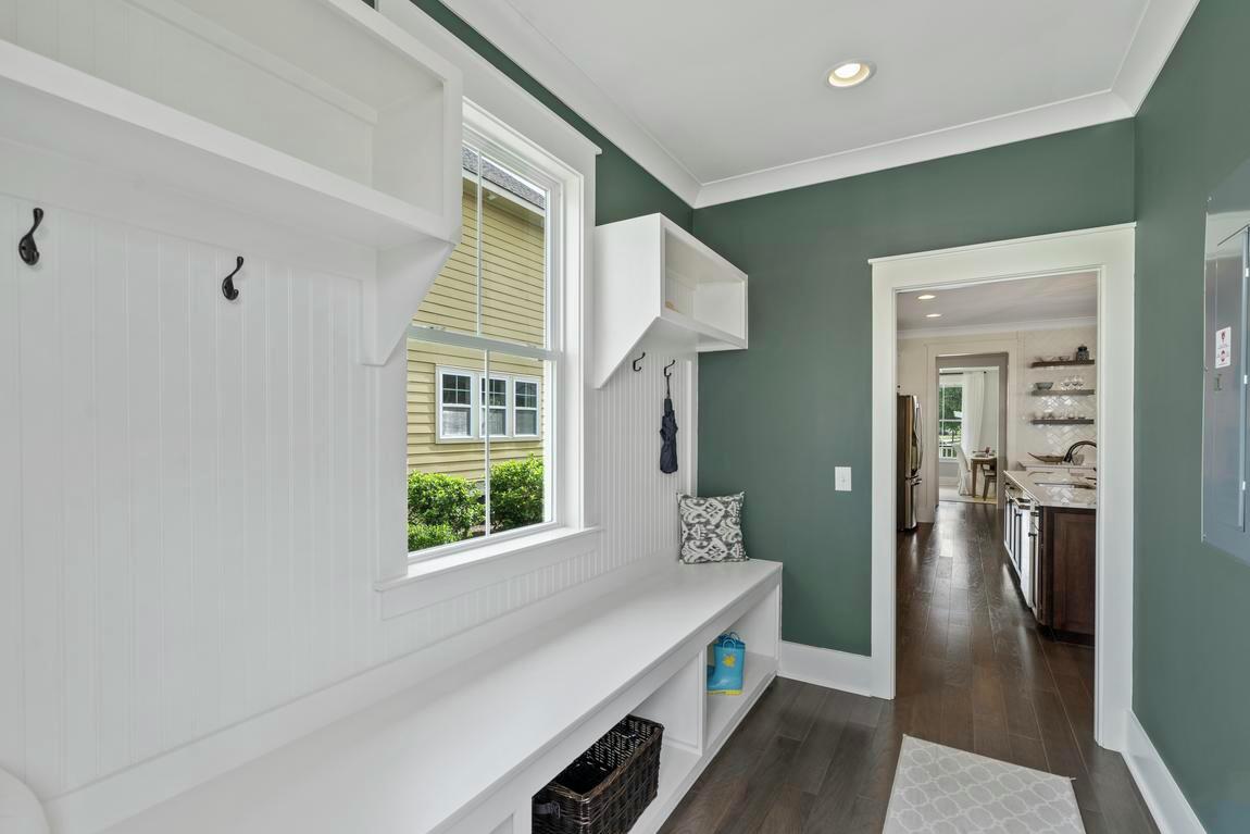 Charming white space with wall-to-wall storage unit