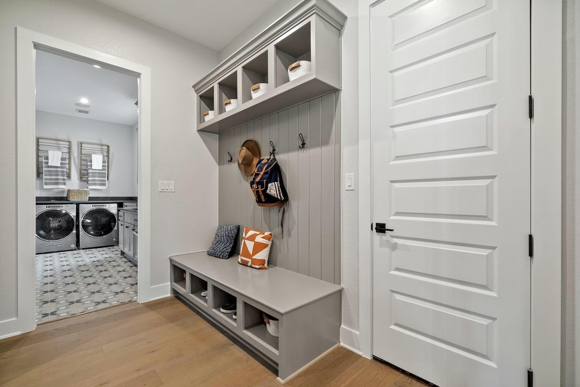 Mudroom with accompanying laundry room