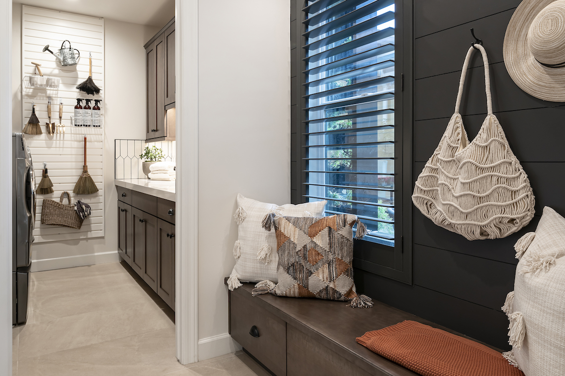 Mudroom highlighted by modern slatwall design