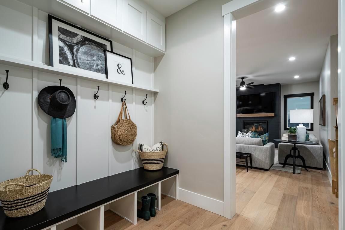 transitional space with hanging racks, and underneath storage