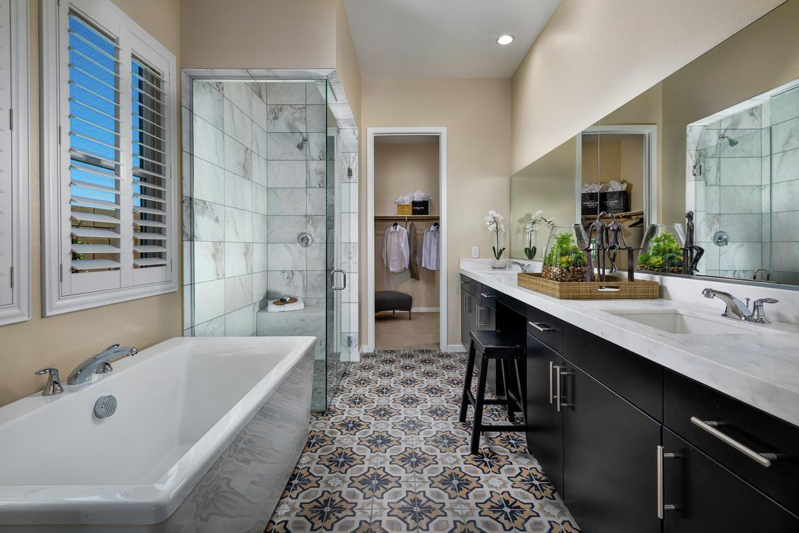 bathroom with embellished floor tile