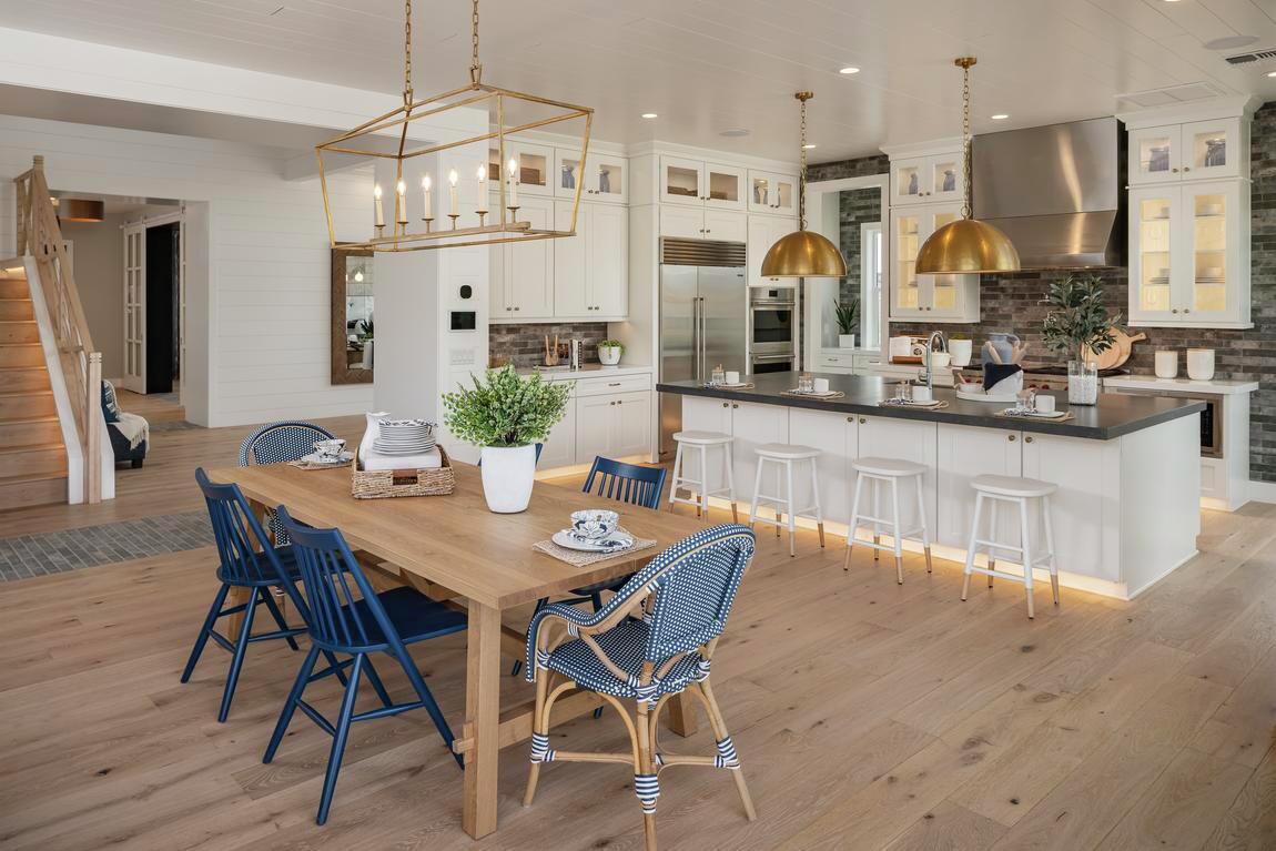 Modern farmhouse kitchen and breakfast nook accented with pops of color and various summer décor ideas